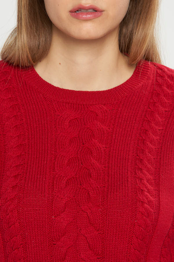 Maglia a trecce e coste in filato di lana merinos e cashmere.