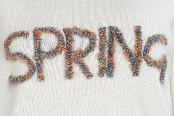 Maglioncino girocollo con scritta "SPRING" in filato di lana merinos e cashmere.